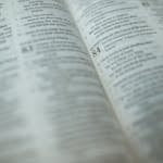 A detailed close-up of a Bible page with a highlighted Psalm, symbolizing faith and spirituality.